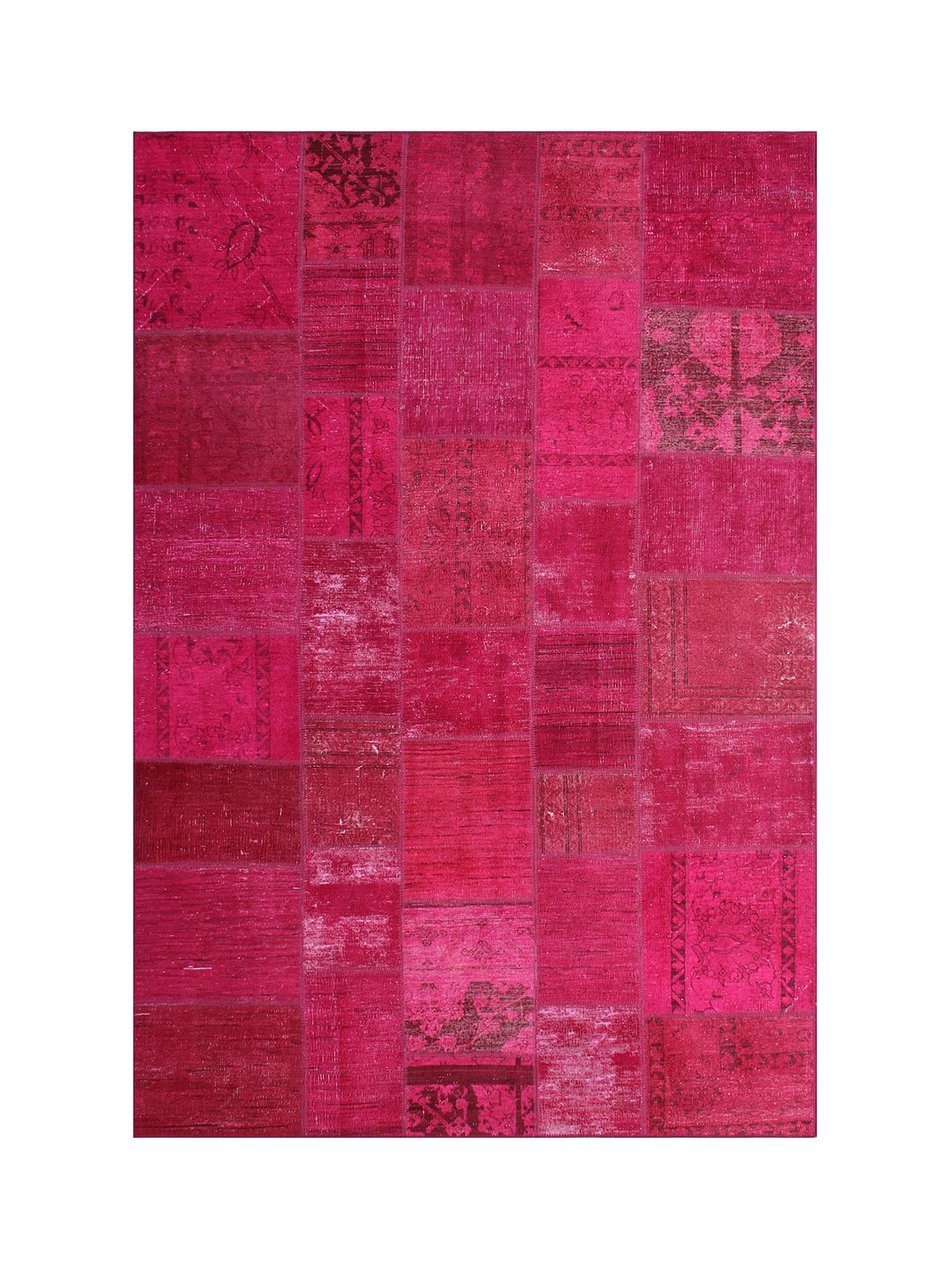 Patchwork rug with pink and red patches on a white background