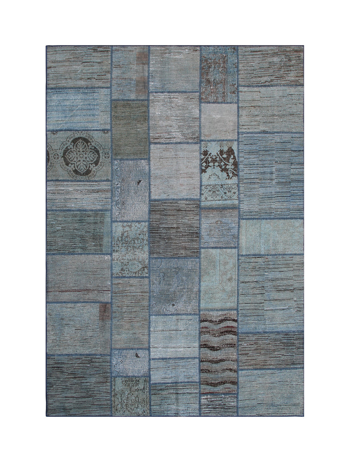 Patchwork rug with blue and gray squares on a white background
