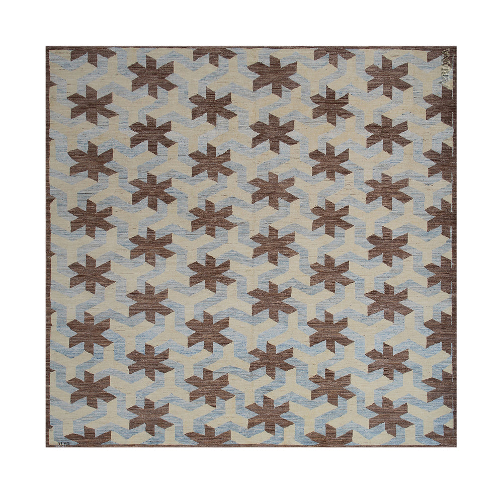 Patterned rug with brown and beige design on a blue background