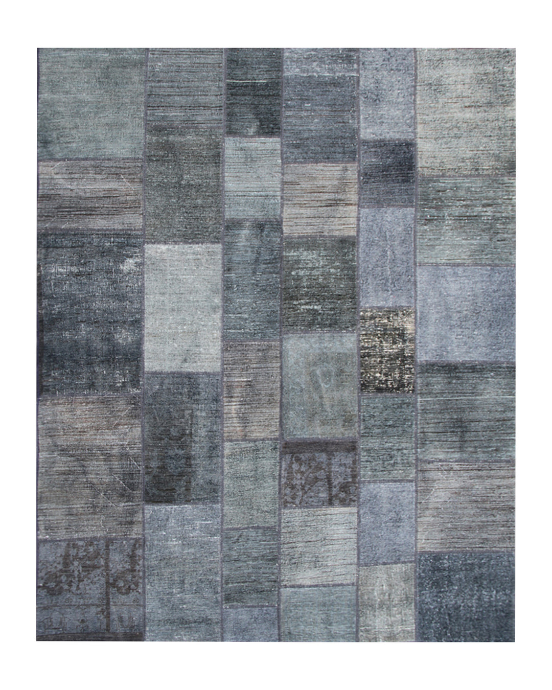 Patchwork rug with various shades of gray on a white background