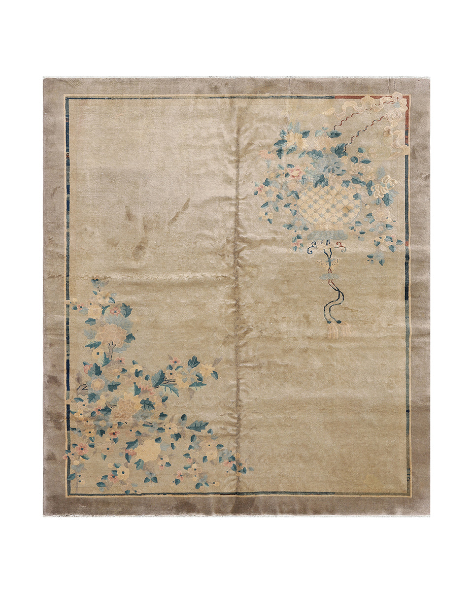 Beige rug with floral patterns on a plain background