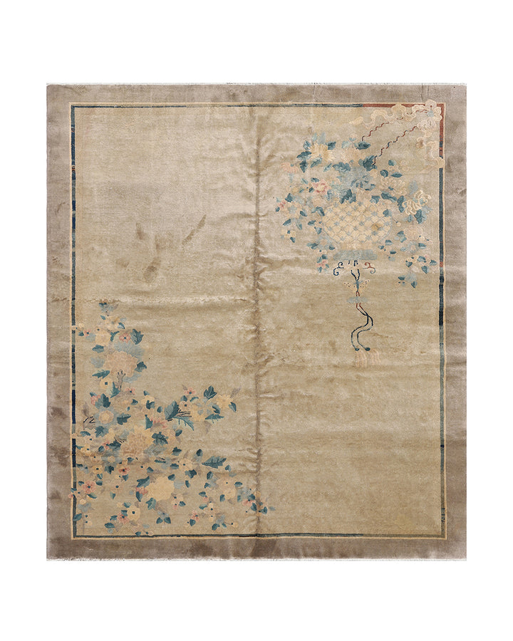 Beige rug with floral patterns on a plain background