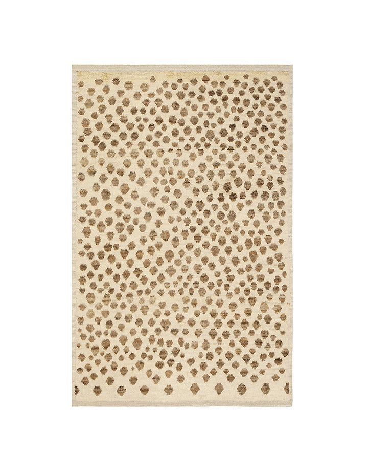 Beige area rug with a subtle pattern on a white background