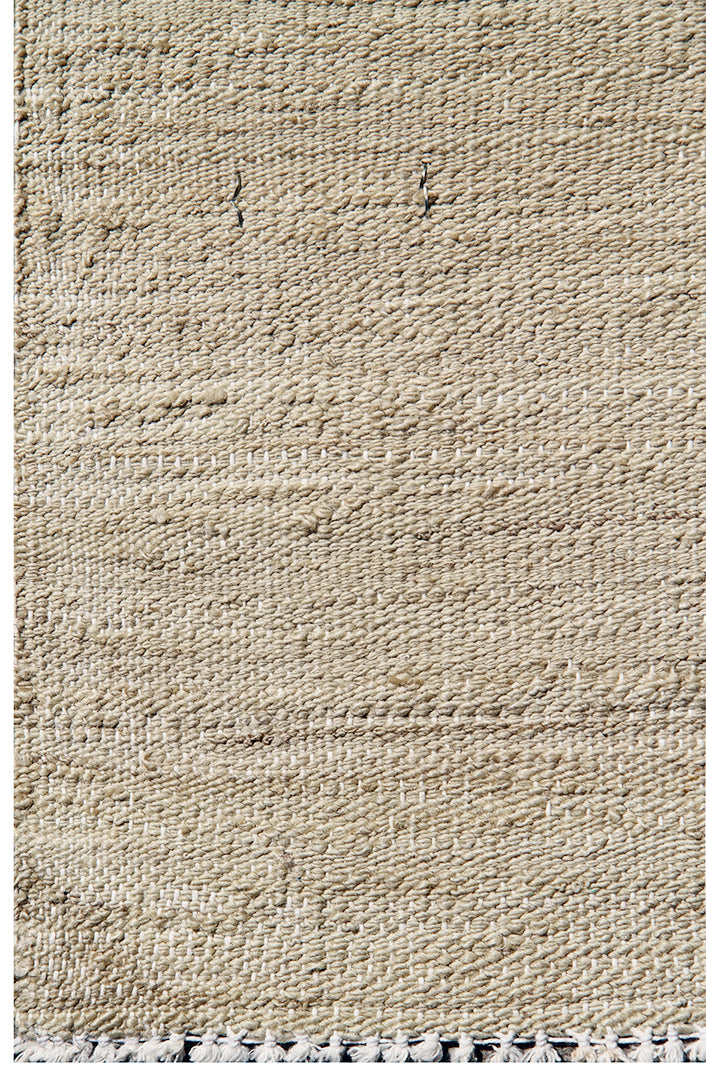 Textured beige rug with a subtle pattern