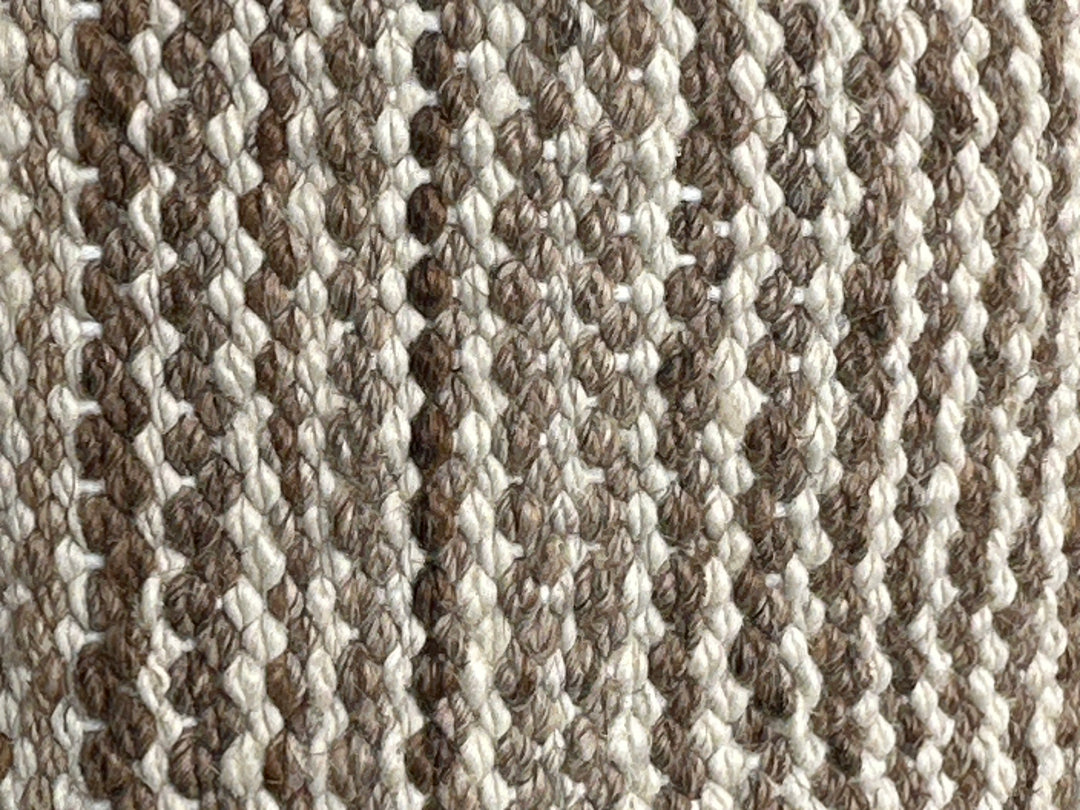 8x11 Ariana Kilim hand-woven Afghan wool rug with earthtone camel, brown, tan, and ivory stripes, full overhead view.