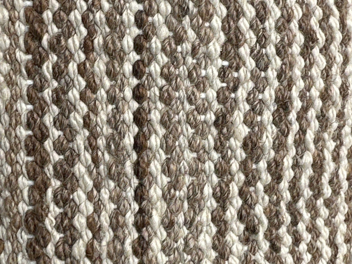8x11 Ariana Kilim hand-woven Afghan wool rug with earthtone camel, brown, tan, and ivory stripes, full overhead view.
