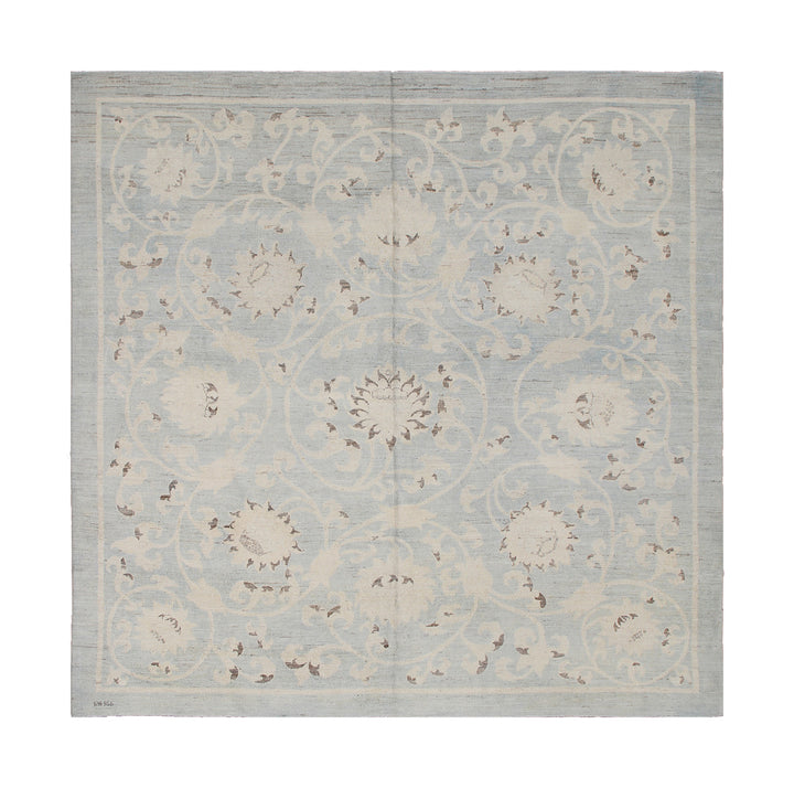 Decorative rug with floral pattern on a light blue background
