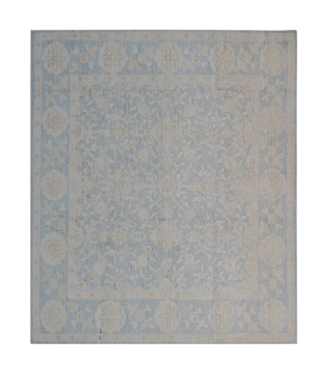 Decorative rug with a floral pattern on a plain background