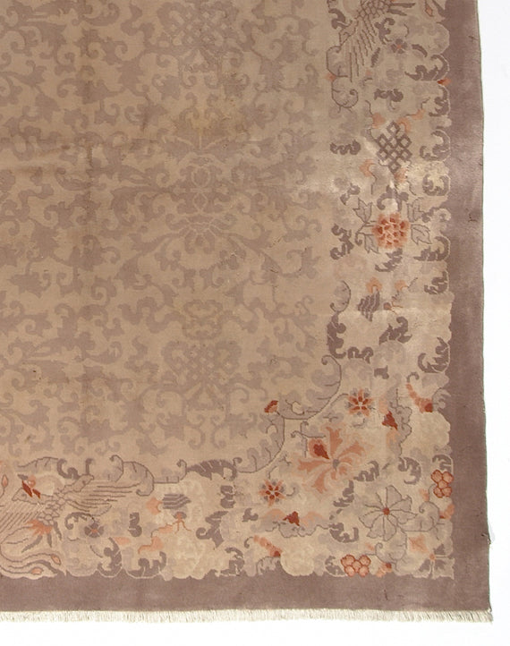 Decorative rug with intricate patterns on a beige background