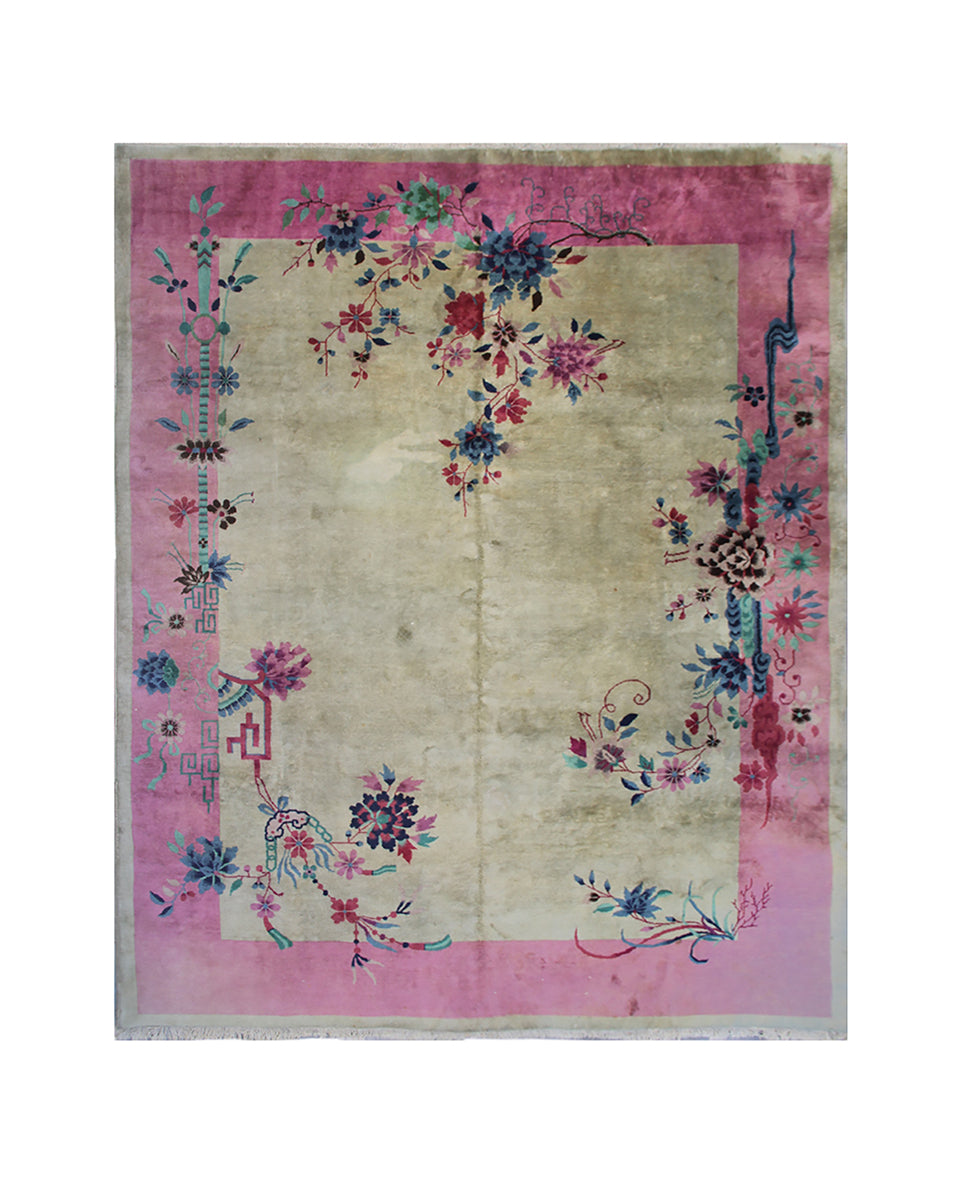 Decorative rug with floral patterns on a pink border