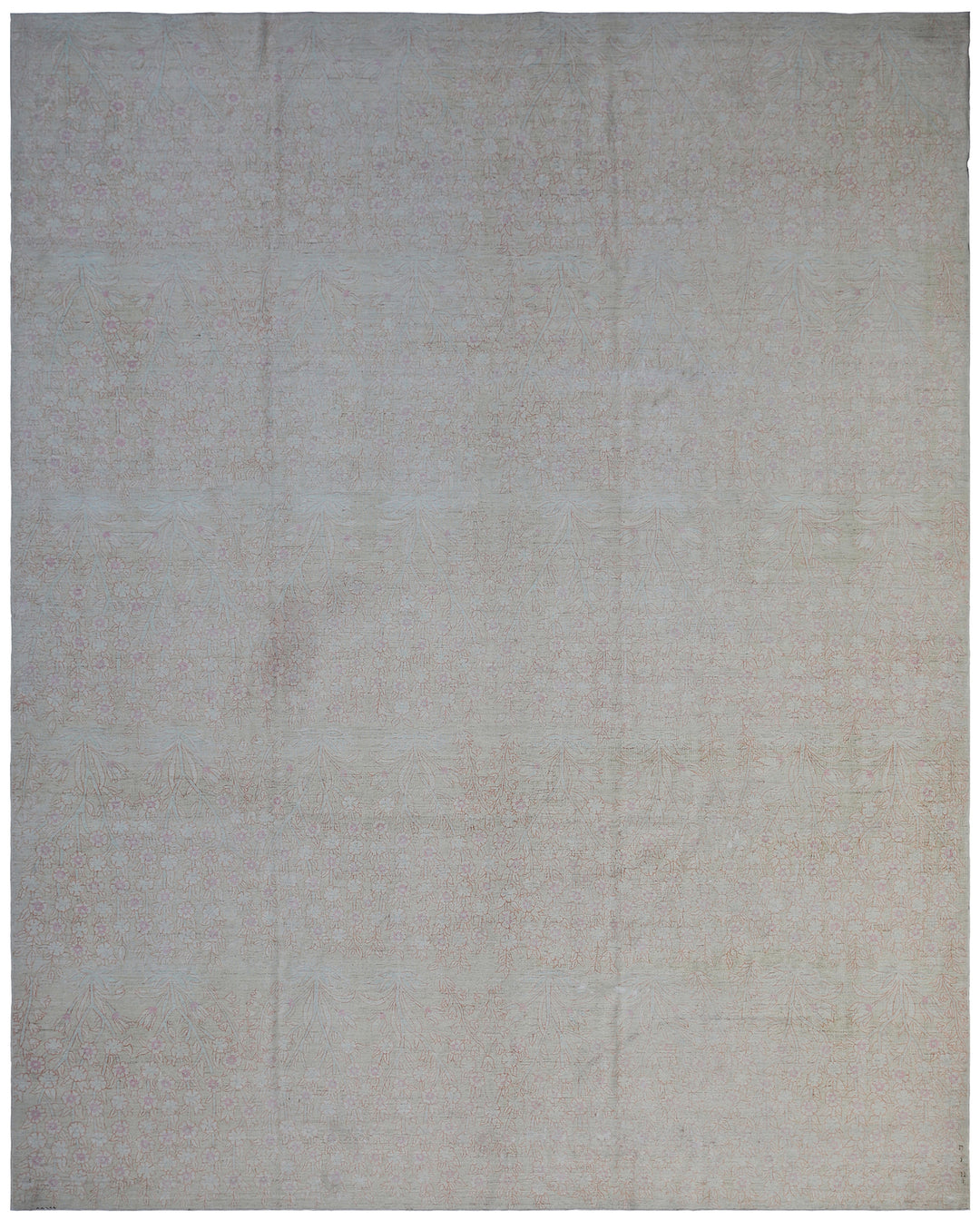 A pale blue pink floral transitional rug with a visible textured pattern.