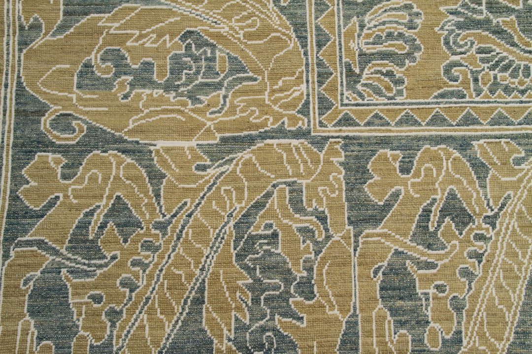 Close-up of a patterned fabric with floral designs in beige and blue.