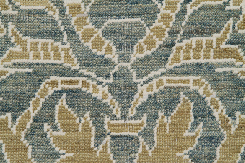 Close-up of a patterned fabric with green and beige colors