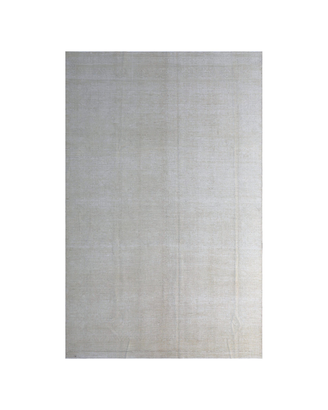 Rectangular rug with a subtle pattern on a white background