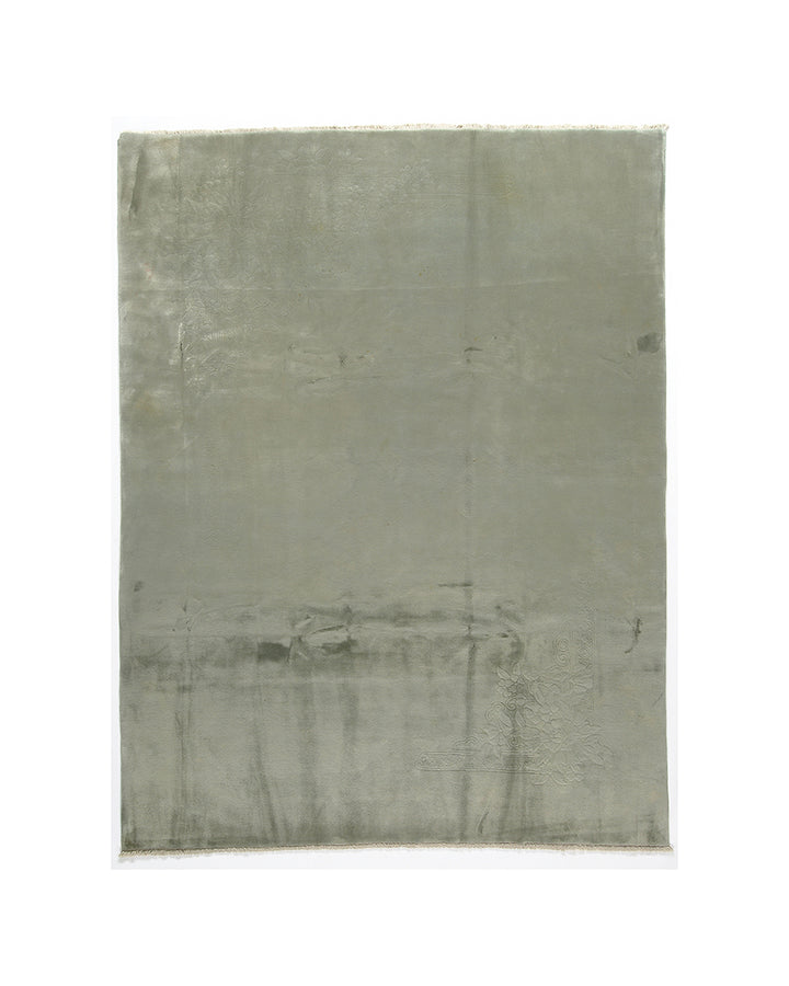 Green rug on a white background