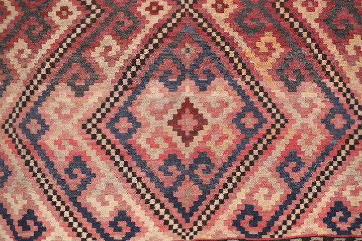 Close-up of a patterned rug with geometric design