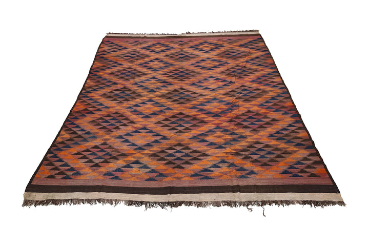 Woven rug with geometric pattern on a white background