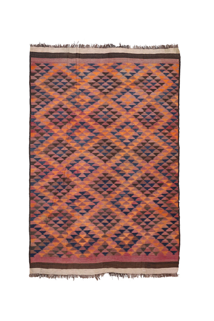 Woven rug with geometric pattern on a white background
