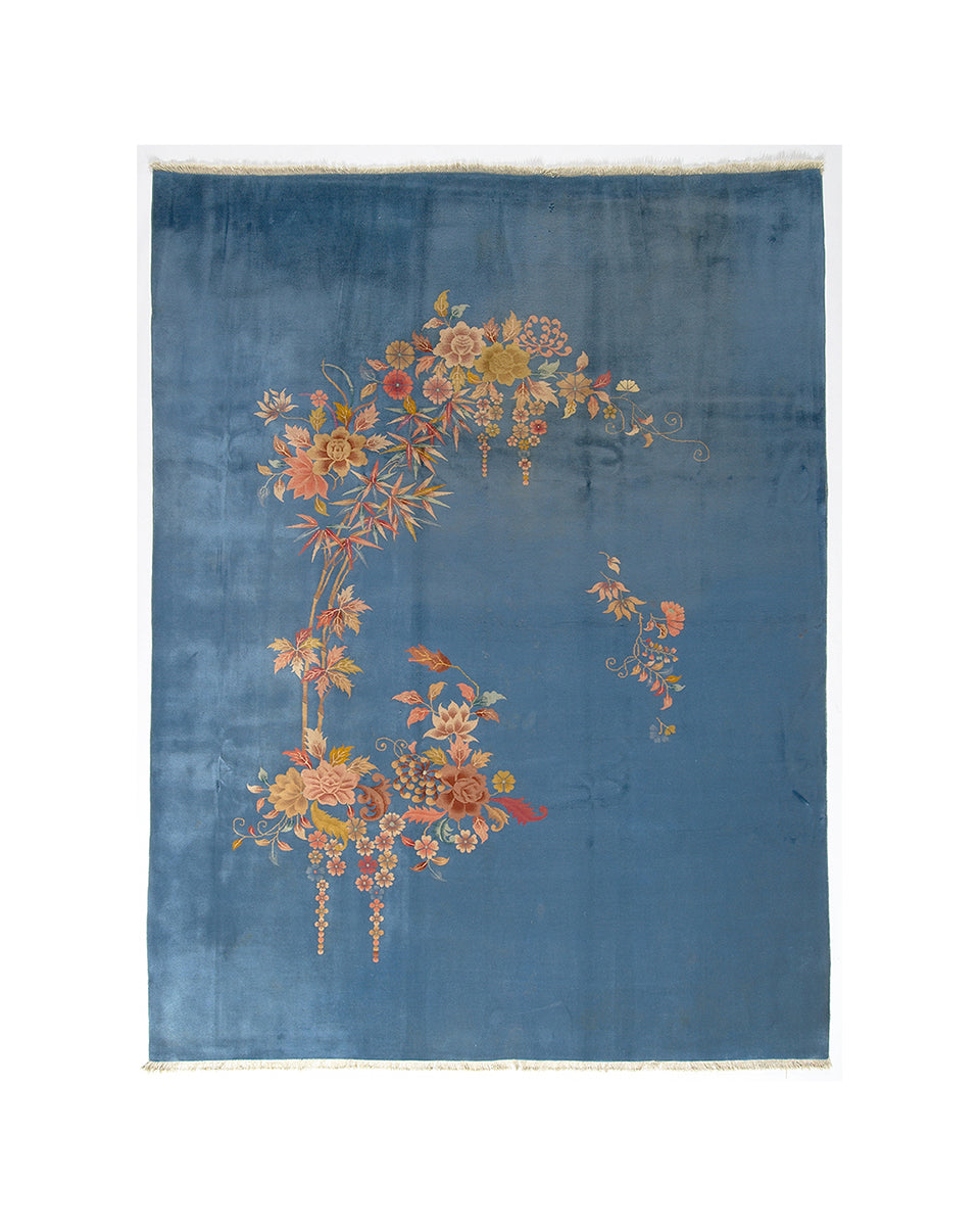 Blue rug with floral patterns on a white background