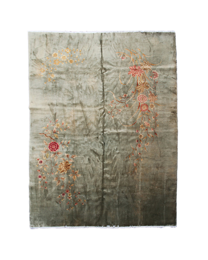Decorative rug with floral patterns on a plain background