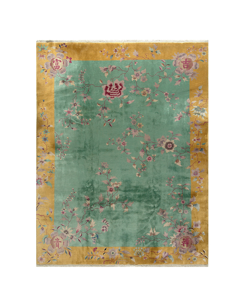Decorative rug with floral patterns and gold border on a white background
