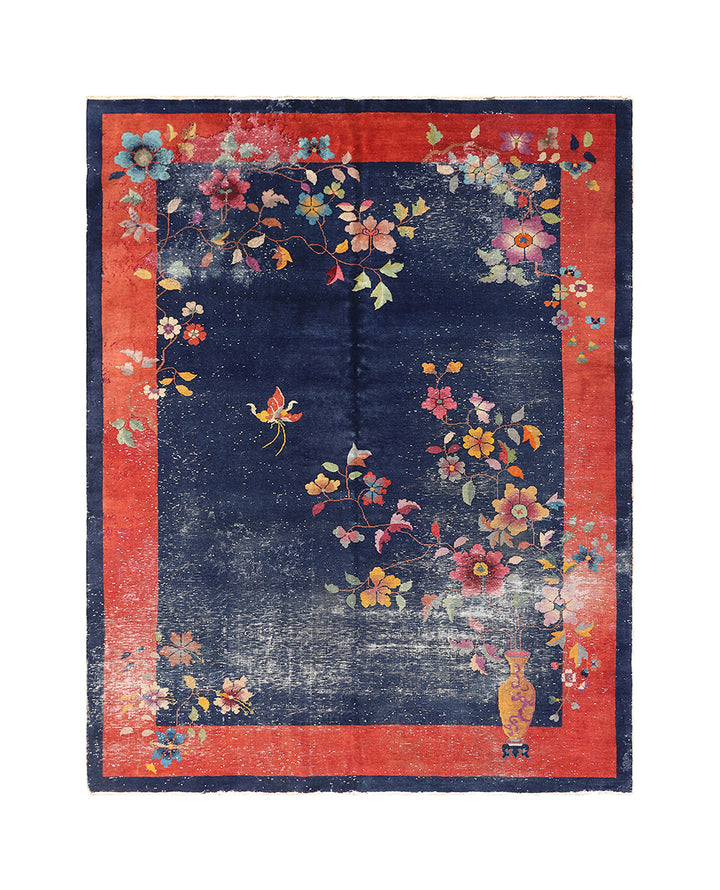 Decorative rug with floral patterns on a blue and red background