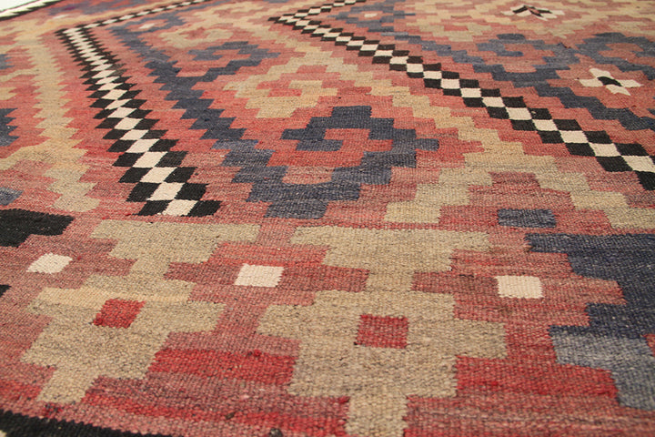 Close-up of a patterned rug with geometric design