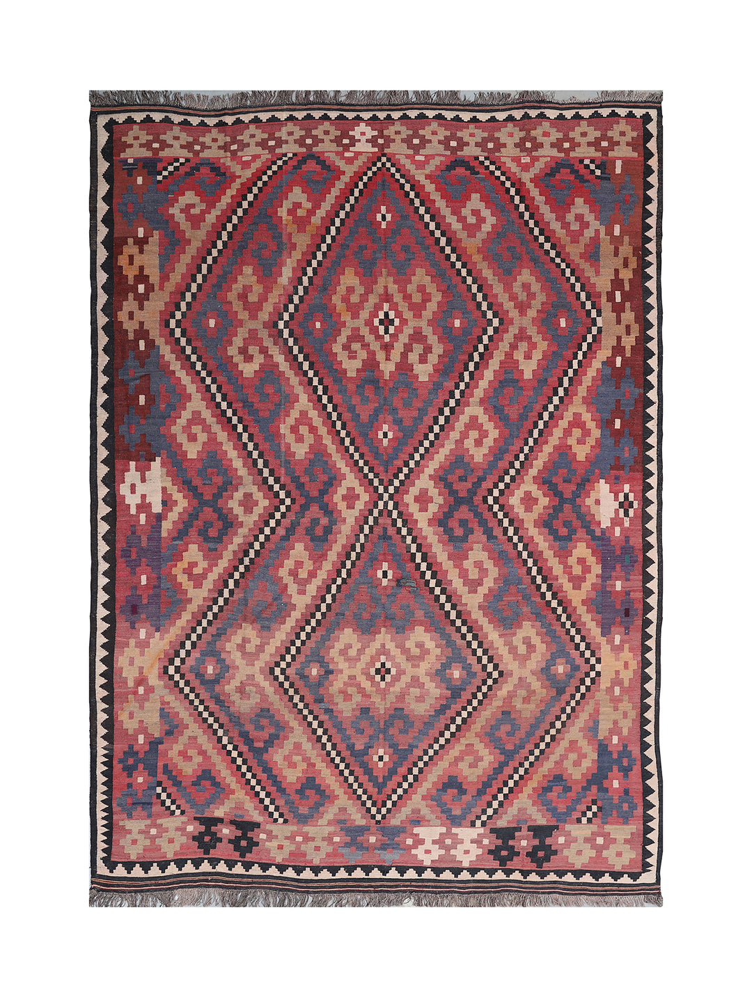 Traditional patterned rug with geometric design on a white background