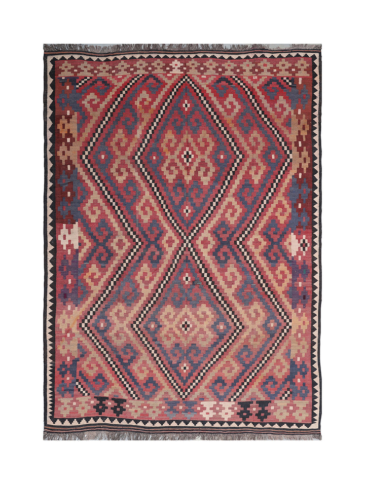 Traditional patterned rug with geometric design on a white background