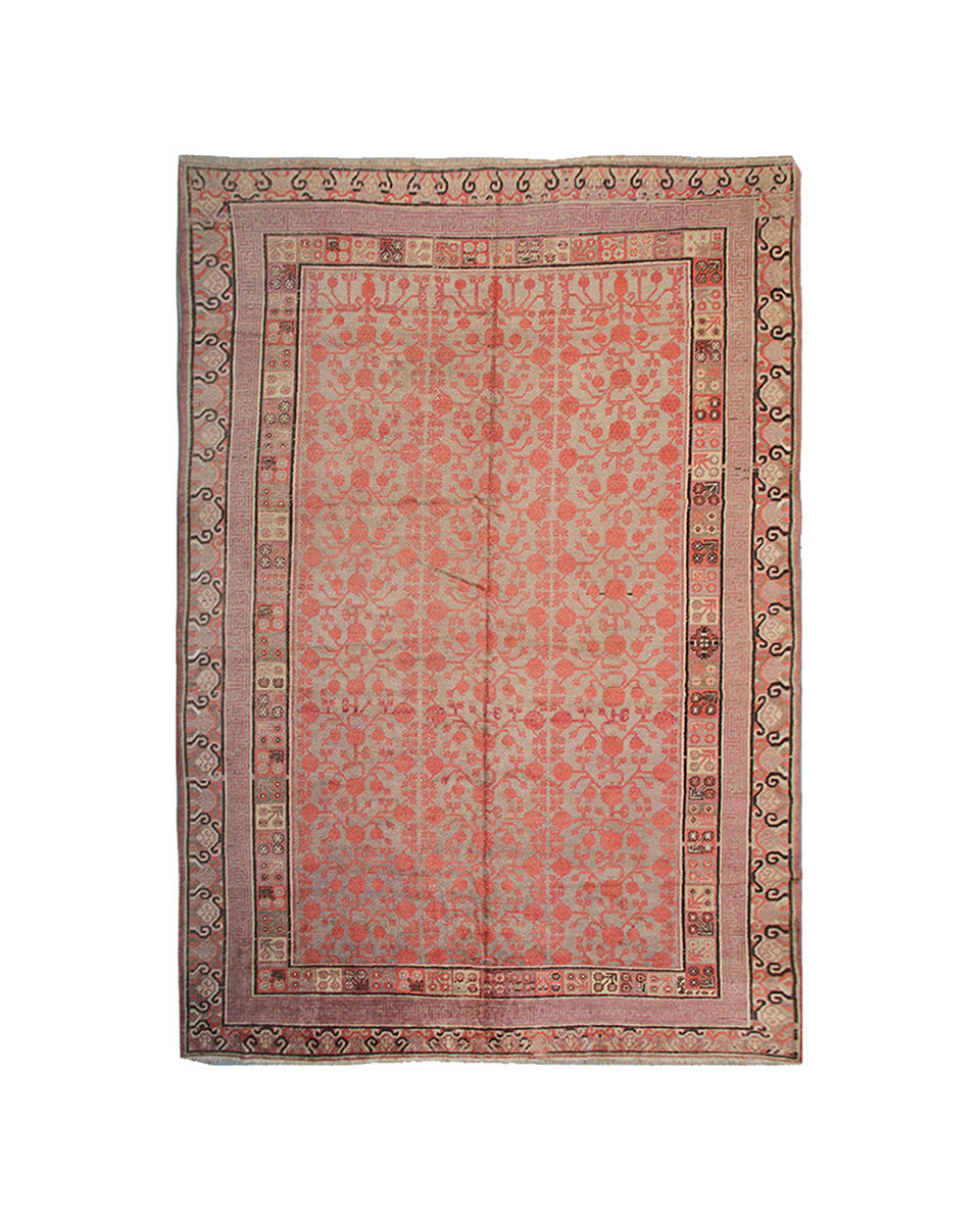 Decorative rug with intricate patterns on a white background