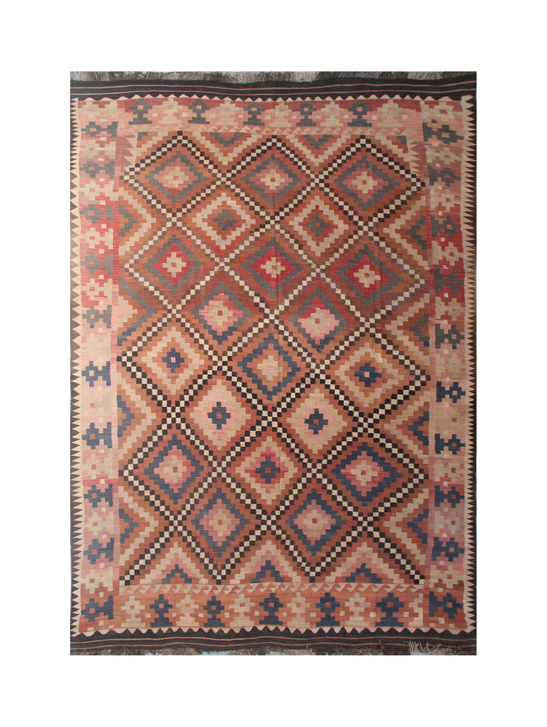 Traditional patterned rug with geometric design on a white background