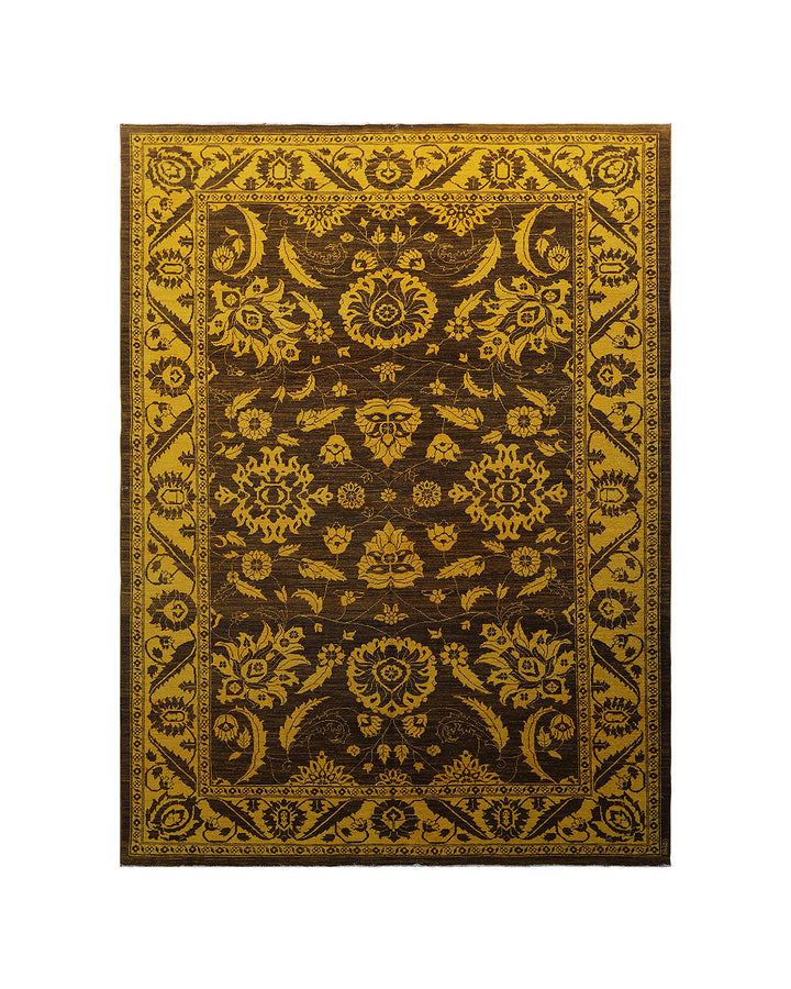 Decorative rug with intricate gold patterns on a brown background