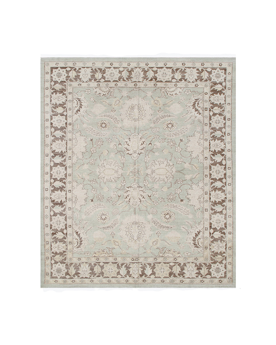 Decorative rug with intricate patterns on a white background
