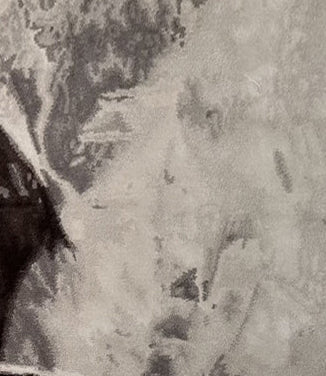 Aerial view of a mountainous landscape with a road winding through the valleys rug