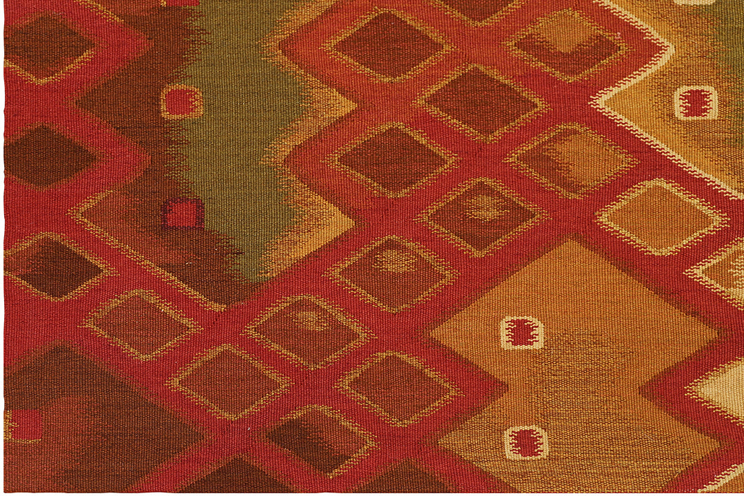 Handwoven modern geometric kilim in red, white, green, and gold, crafted from organic wool by women artisans. Luxury contemporary flatweave from the Ariana Kilim Collection.