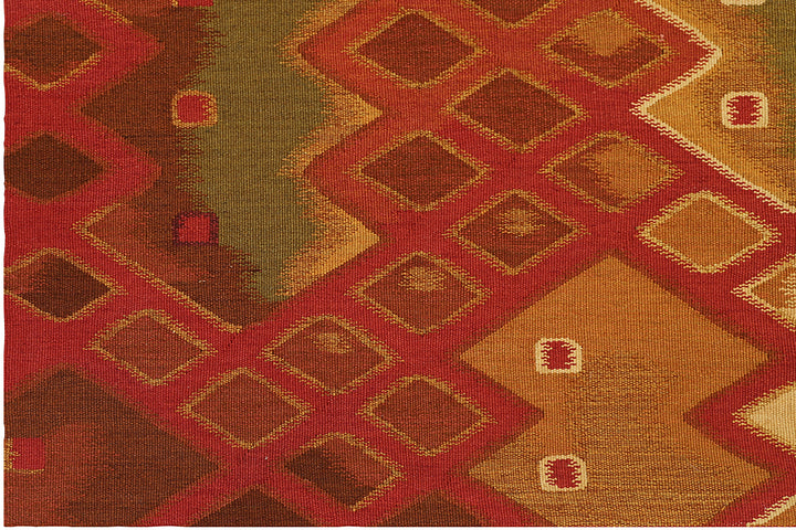 Handwoven modern geometric kilim in red, white, green, and gold, crafted from organic wool by women artisans. Luxury contemporary flatweave from the Ariana Kilim Collection.