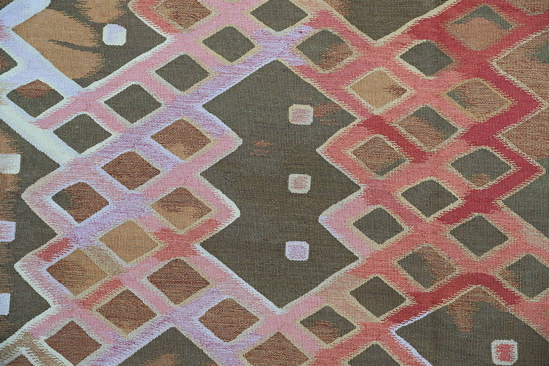 Handwoven modern geometric kilim in red, white, green, and gold, crafted from organic wool by women artisans. Luxury contemporary flatweave from the Ariana Kilim Collection.