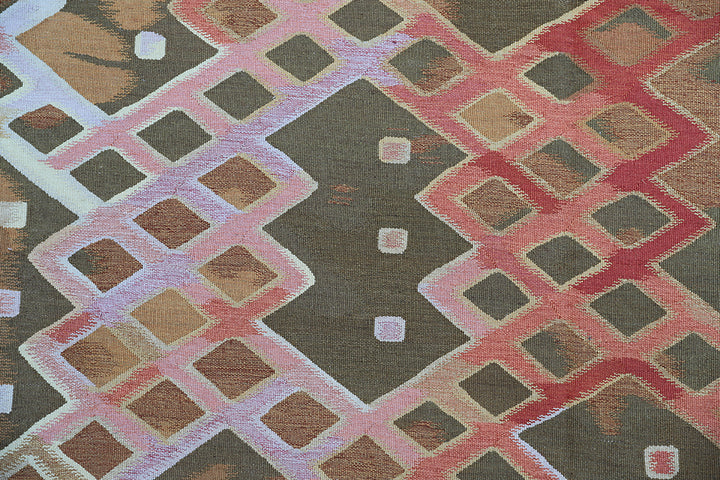 Handwoven modern geometric kilim in red, white, green, and gold, crafted from organic wool by women artisans. Luxury contemporary flatweave from the Ariana Kilim Collection.