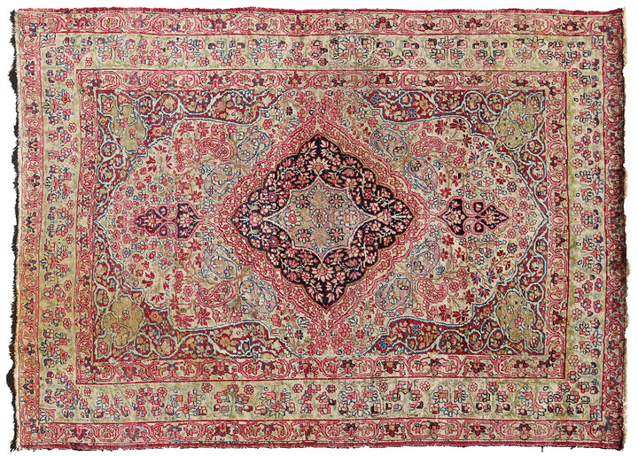 Late 19th-century antique Persian Kermanshah rug featuring a dark navy center medallion on an ivory floral field with pink, red, and blue botanical details