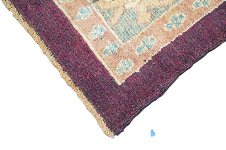 15x10 Dark Brown Burgundy Turkish Ushak rug with ivory and pastel orange Arts and Crafts floral pattern.