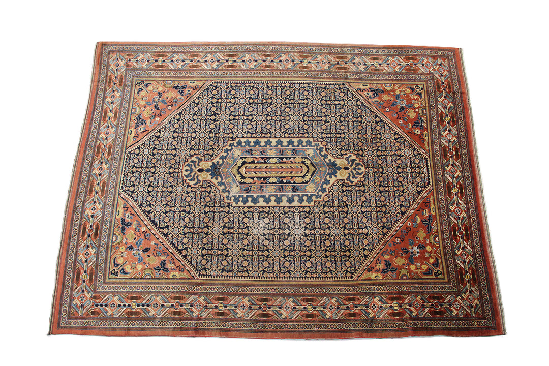 A large 9'4" x 12'2" vintage Khorasan wool rug featuring a navy blue field with intricate geometric patterns and a traditional Persian border.