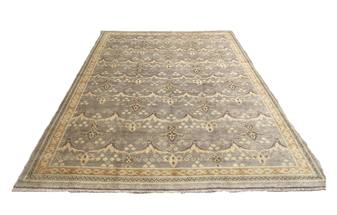 Hand-knotted 7' x 9'9" Afghan Oushak rug with an Ottoman design in soft grey, cream, and brown.