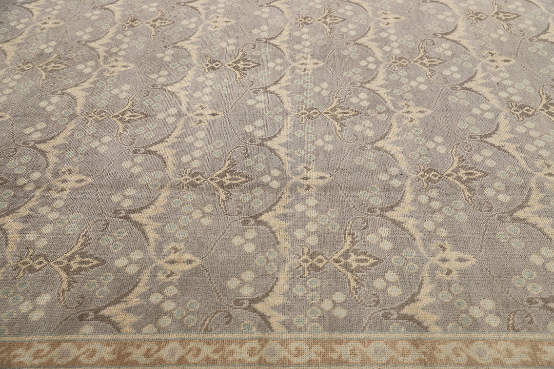 Hand-knotted 7' x 9'9" Afghan Oushak rug with an Ottoman design in soft grey, cream, and brown.