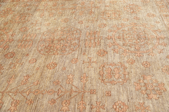 Hand-knotted 8'4" x 10' Afghan Oushak rug featuring a Samarkand medallion in soft coral and terracotta tones over a gray field.