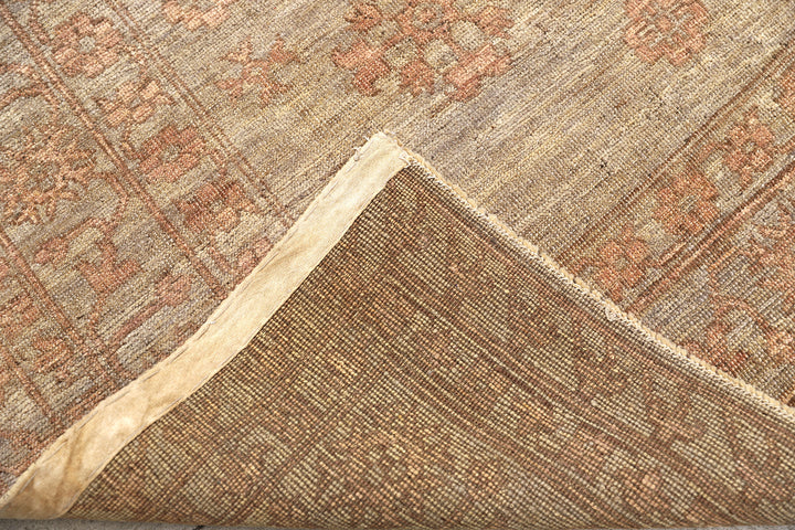 Hand-knotted 8'4" x 10' Afghan Oushak rug featuring a Samarkand medallion in soft coral and terracotta tones over a gray field.