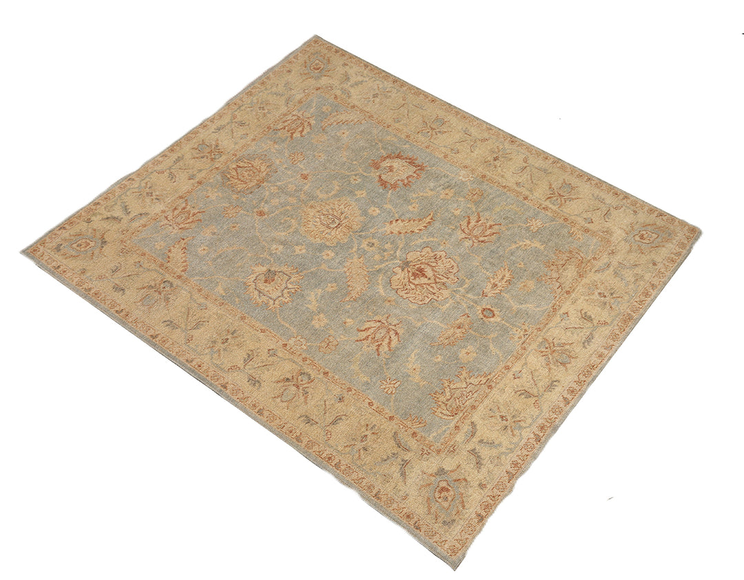 Hand-knotted 8'1" x 9'7" Afghan Oushak rug featuring a soft sky blue field with a sand goldish yellow border and terracotta and cream floral motifs.
