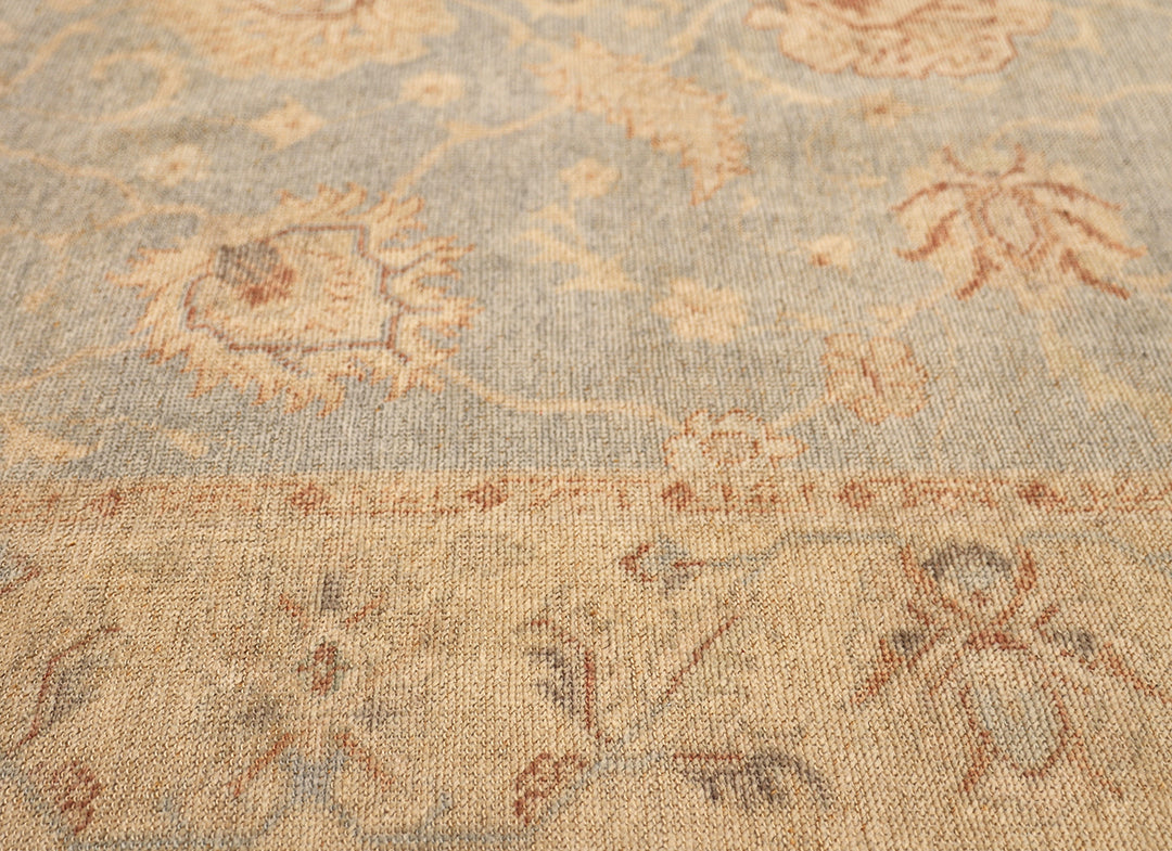 Hand-knotted 8'1" x 9'7" Afghan Oushak rug featuring a soft sky blue field with a sand goldish yellow border and terracotta and cream floral motifs.