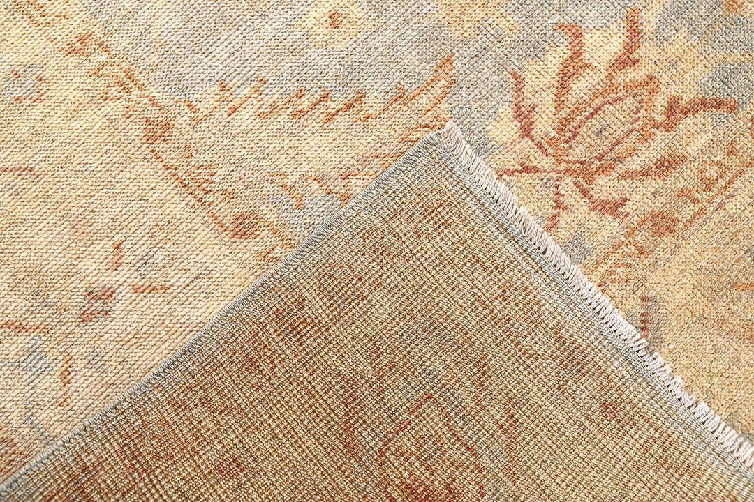 Hand-knotted 8'1" x 9'7" Afghan Oushak rug featuring a soft sky blue field with a sand goldish yellow border and terracotta and cream floral motifs.