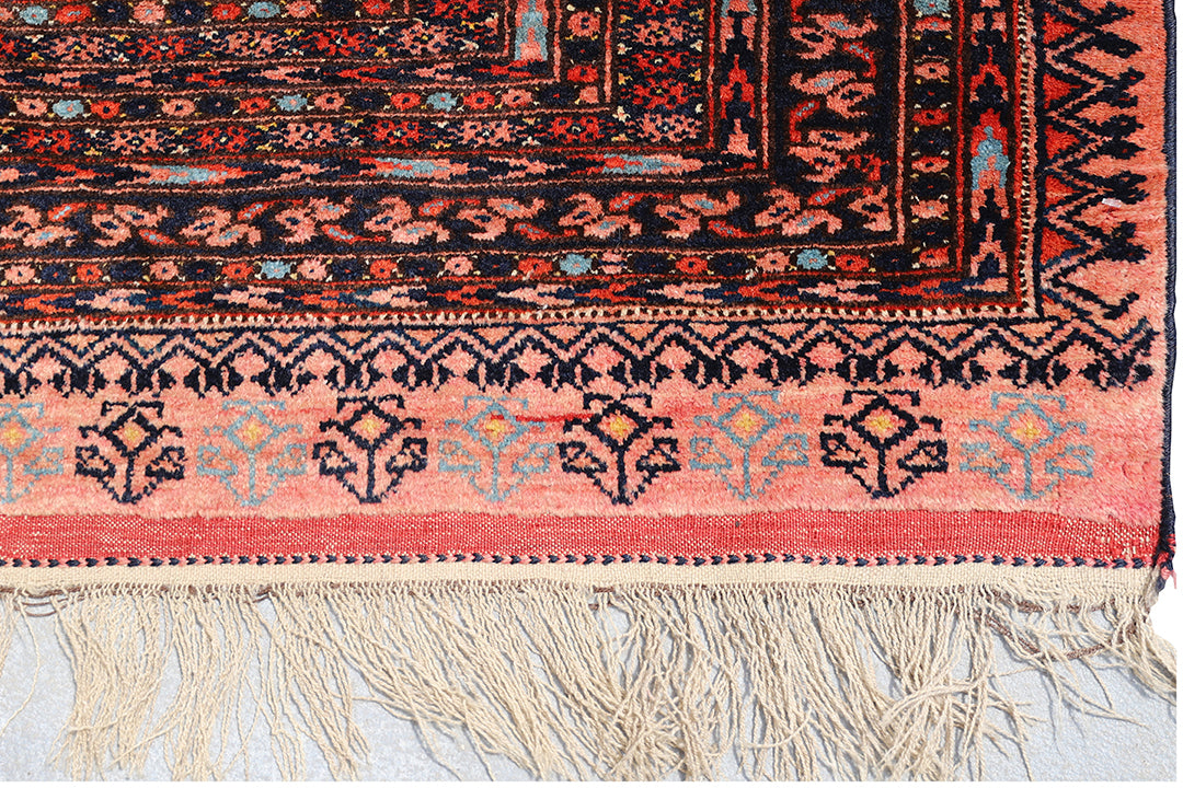 Authentic Afghan Sarik Saruk design wool rug 3x1x6x6 with unusual salmon background, red, blue, brown geometric pattern, and multiple borders