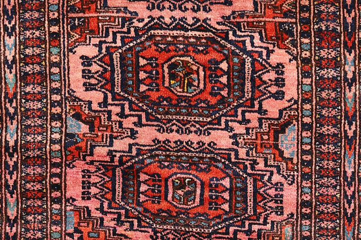 Authentic Afghan Sarik Saruk design wool rug 3x1x6x6 with unusual salmon background, red, blue, brown geometric pattern, and multiple borders